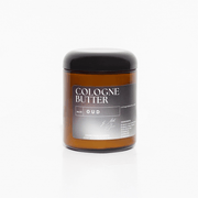 Whipped OUD Body Butter with creamy texture in amber jar